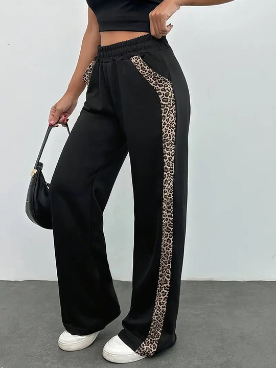 Zwarte Luipaardprint Joggingbroek Dames met Elegante Zijslit en Lichtgewicht Design - ZovaFashion - Joggingbroek dames
